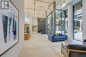 Milton (Om Old Milton) condo for rent - A spacious office lobby with a reception desk and a large window overlooking the street.