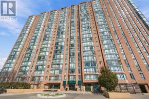 Mississauga (Cooksville) condo for rent - A tall building with many windows and a sign that says "REALTOR®".