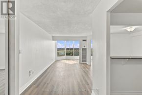 Mississauga (Cooksville) condo for rent - A white room with a slanted ceiling and a view of the outdoors through a window.