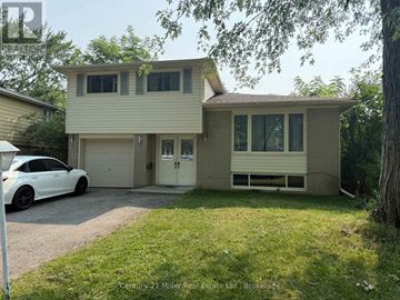 Brampton (Brampton East) apartment for rent - A two-story house with a white car parked in front.