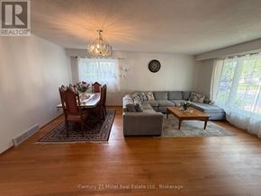 Brampton (Brampton East) apartment for rent - A living room with a couch, chairs, and a coffee table.