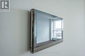 Oakville (Go Glenorchy) condo for rent - A flat screen TV mounted on a wall.