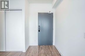 Oakville (Go Glenorchy) condo for rent - A room with a grey door and a white wall.