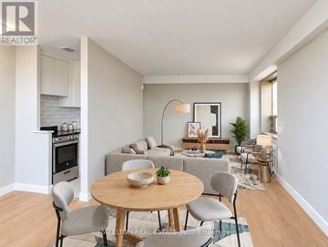 Toronto (Annex) condo for rent - A modern living room with a dining table and chairs.