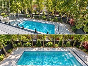 Toronto (Leaside) apartment for rent - A pool surrounded by trees and plants.