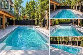 Toronto (Leaside) apartment for rent - A swimming pool surrounded by a black fence and trees.