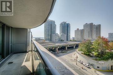 Toronto (Waterfront Communities) condo for rent - A view from a balcony of a building with the text "NORTH 2 SOUTH REALTY, Brokerage" on the image.