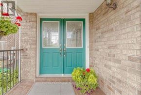 Brampton (Fletcher's Meadow) apartment for rent - A blue double door with glass panels and a metal railing on the left side.