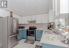 Brampton (Fletcher's Meadow) apartment for rent - A kitchen with a refrigerator, oven, and sink.