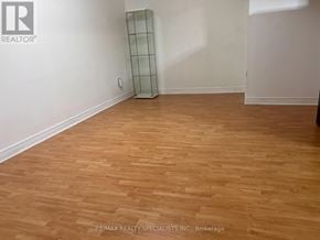 Mississauga (Meadowvale) apartment for rent - A room with wooden flooring and a glass cabinet.