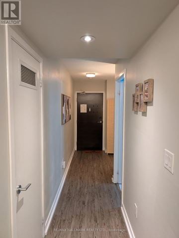 Toronto (Waterfront Communities) condo for rent - A hallway with a door on the left and a door on the right.