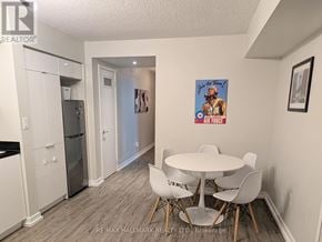 Toronto (Waterfront Communities) condo for rent - A dining room with a white table and chairs.