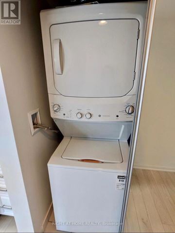 Toronto (Yorkdale-Glen Park) condo for rent - A white dishwasher is in a kitchen.