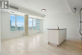 Toronto (Niagara) condo for rent - A spacious room with a reception desk and large windows.