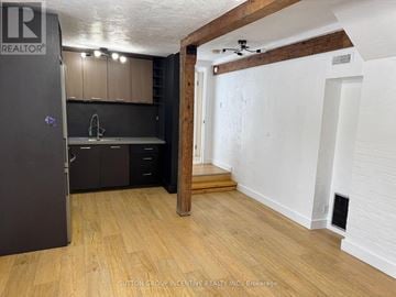 Toronto (Willowdale West) apartment for rent - A kitchen with a refrigerator, sink, and cabinets.