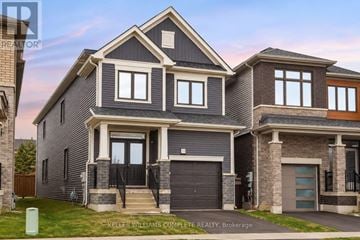 Haldimand apartment for rent - A modern house with a grey and brown exterior is for sale.