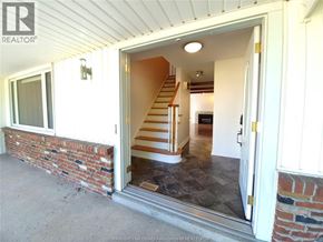 Windsor apartment for rent - A house with a staircase leading to the second floor is for sale.