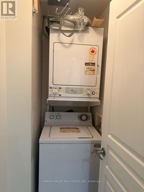 Toronto (Waterfront Communities) condo for rent - A small white fridge with a stove underneath it.