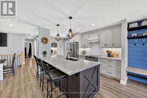 Springwater (Snow Valley) apartment for rent - A modern kitchen with a large island and pendant lights.