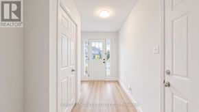 Kitchener townhouse for rent - A hallway with white doors and a light on the ceiling.
