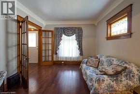 Niagara Falls apartment for rent - A room with a couch and a window with curtains.