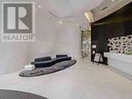 Toronto (Church-Yonge Corridor) condo for rent - A realtor logo is on a wall in a spacious room.