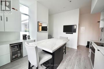 Toronto (Church-Yonge Corridor) condo for rent - A modern kitchen with a dining table and chairs.