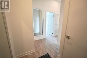 Toronto (Church-Yonge Corridor) condo for rent - A hallway with a door on the right and a mirror on the left.