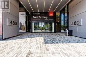 Toronto (Waterfront Communities) condo for rent - The entrance to a Nov Selling store with a glass door.