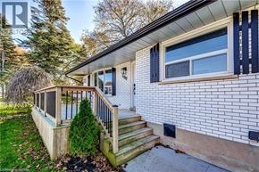 Palmerston apartment for rent - A house with a white brick exterior and a balcony.