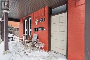 Ottawa duplex for rent - A red brick house with a white door and a sign that reads 511.