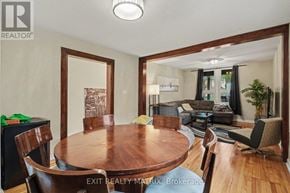 Ottawa duplex for rent - A dining room with a wooden table and chairs.
