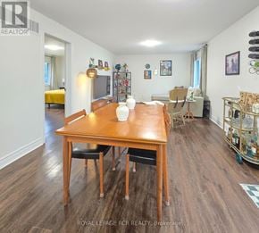 East Gwillimbury triplex for rent - A dining room with a wooden table and chairs.