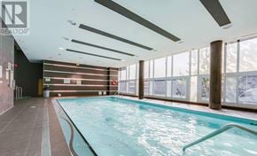Toronto (Mimico) condo for rent - A large indoor swimming pool with a long lane in the middle.