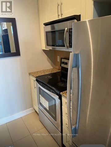Mississauga (Creditview) condo for rent - A kitchen with a stainless steel refrigerator and microwave.