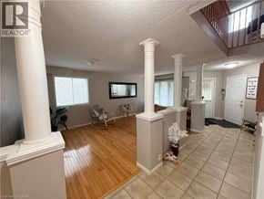 Cambridge apartment for rent - A living room with a white column and a wooden floor.