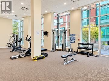 Vancouver apartment for rent - A gym with treadmills, weights, and exercise equipment.