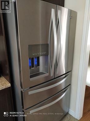 Brampton (Heart Lake East) townhouse for rent - A stainless steel refrigerator with a water dispenser in the middle.