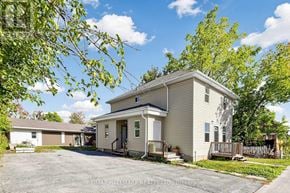 Kawartha Lakes (Lindsay) triplex for rent - A two-story house with a garage is for sale.