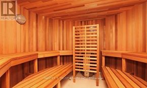 Toronto (Waterfront Communities) condo for rent - A sauna room with wooden benches and walls.