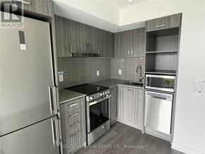 Toronto (Church-Yonge Corridor) condo for rent - A kitchen with a refrigerator, oven, and microwave.