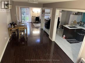 Milton (Cl Clarke) townhouse for rent - A well lit kitchen and dining area with wooden floors.