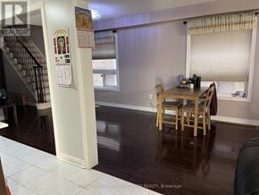 Milton (Cl Clarke) townhouse for rent - A dining room with a table and chairs.