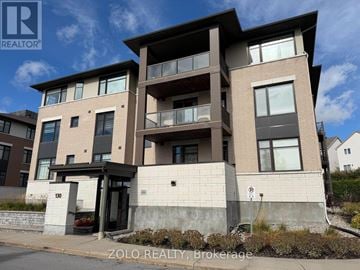 Ottawa condo for rent - A modern two-story residential building with a balcony on the second floor.