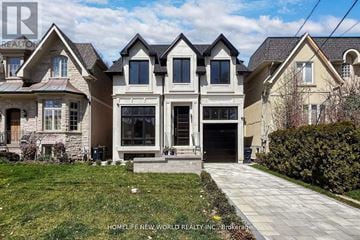Toronto (Leaside) apartment for rent - A large, multi-level house with a stone foundation and a driveway leading to the garage.