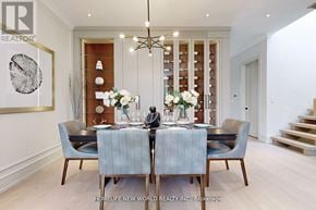 Toronto (Leaside) apartment for rent - A dining room with a table set for two and a chandelier hanging from the ceiling.