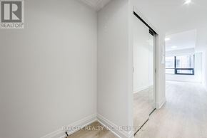 Toronto (Thorncliffe Park) condo for rent - A white room with a doorway leading to another room.