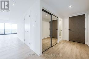 Toronto (Thorncliffe Park) condo for rent - A room with a sliding door and a mirror on the wall.