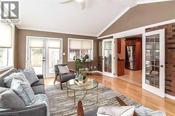 Grimsby apartment for rent - A living room with a grey couch and a glass coffee table.