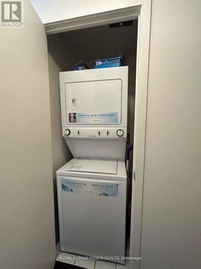 Toronto (South Parkdale) condo for rent - A white washer and dryer in a small laundry room.